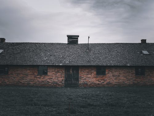 A Brick Building under a Gloomy Sky