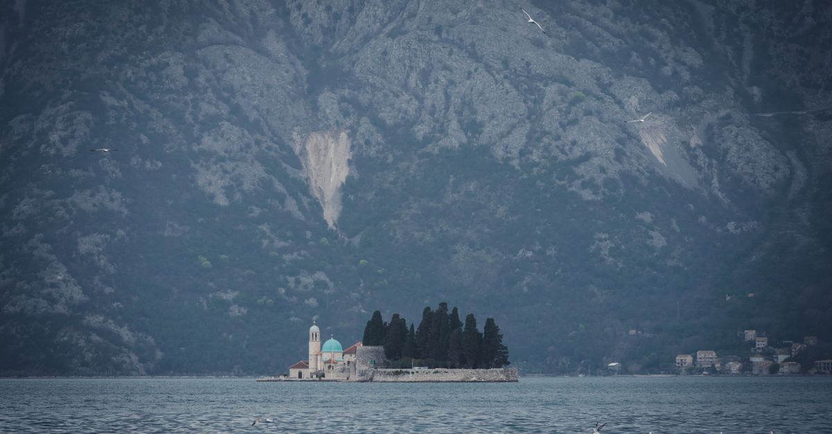 Perast Montenegro bay sunset with stone church island