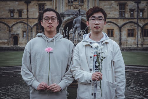 Portrait of Men with Flowers