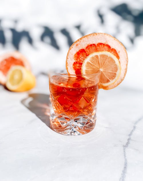 A Close-Up Shot of a Cocktail with Sliced Fruits