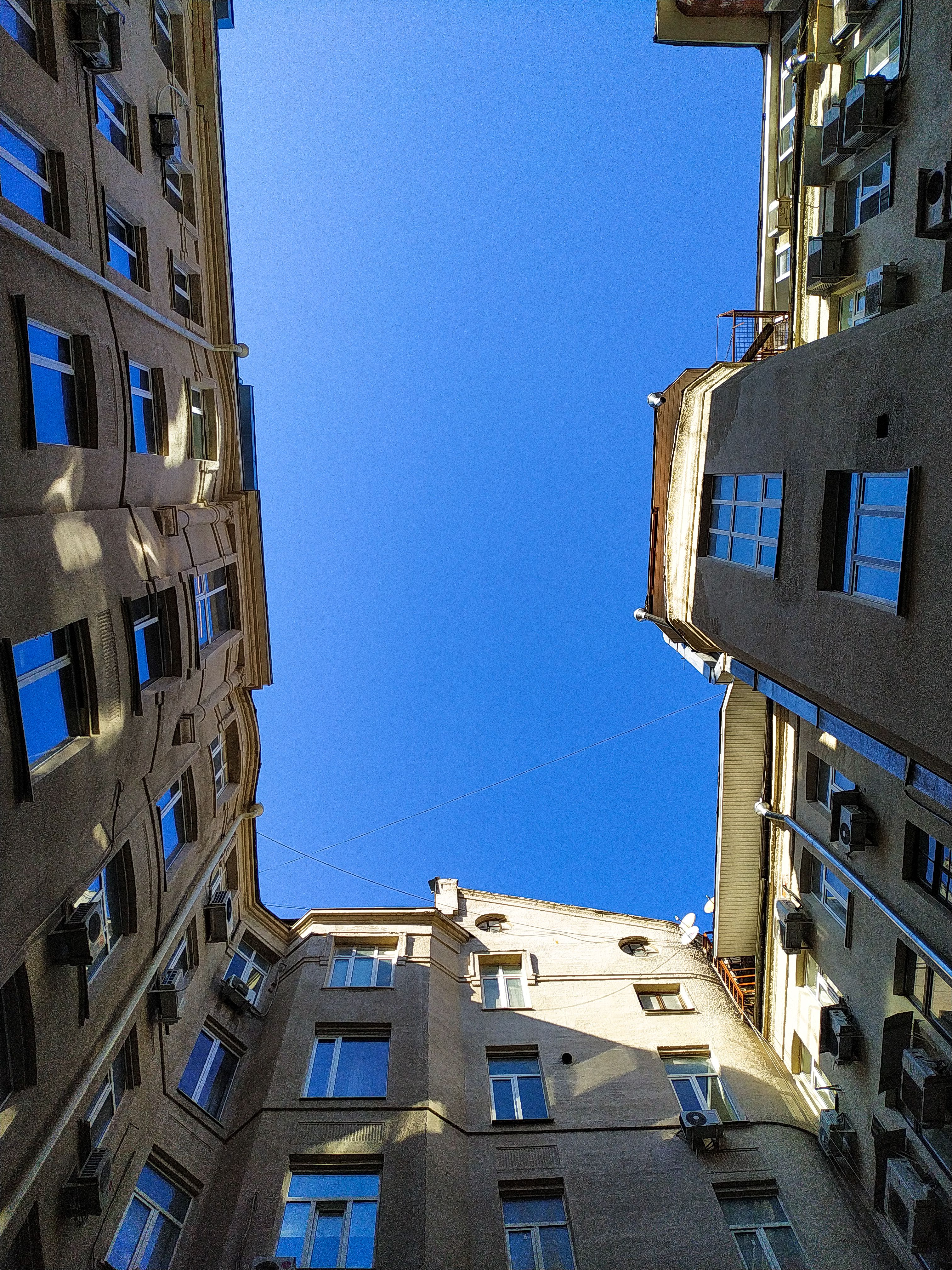 Brown Concrete Building Under Clear Blue Sky · Free Stock Photo