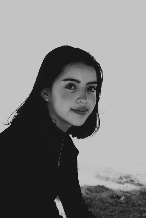 Free Grayscale portrait of a young woman smiling outdoors in Pachuca, Mexico. Stock Photo