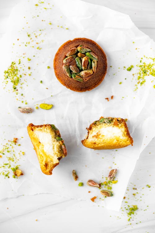 Bread with Pistachio Nuts on White Parchment Paper