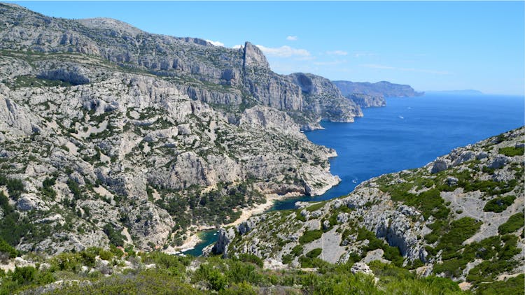 Aerial View Of Bay With A Narrow Inlet Between Mountains