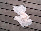 Vintage slip petticoat on wooden jetty