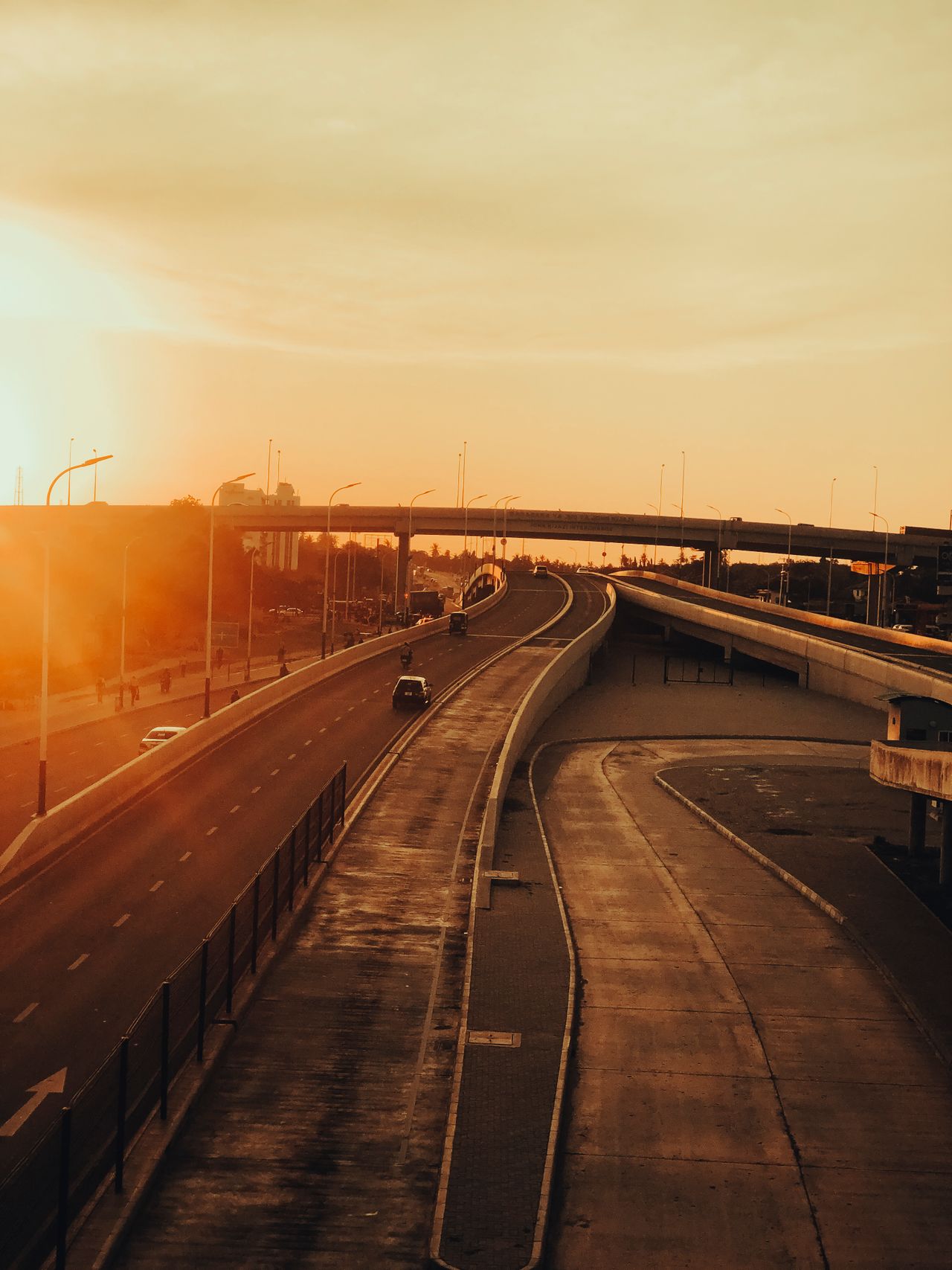 Aerial view of Dar es Salaam highway during sunset with warm golden hues