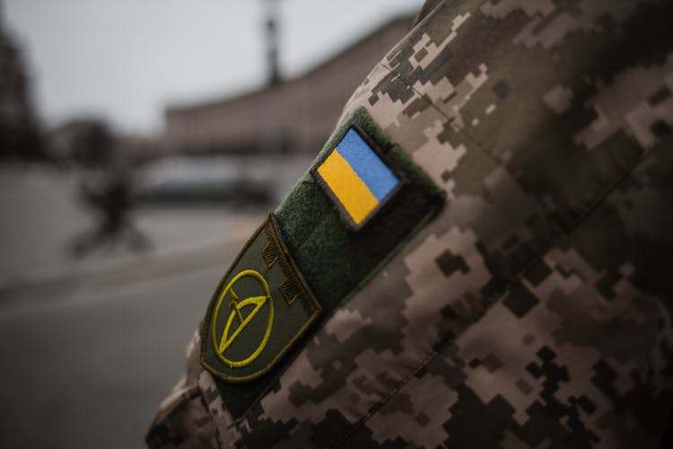 Close Up Of A Flag On A Military Uniform