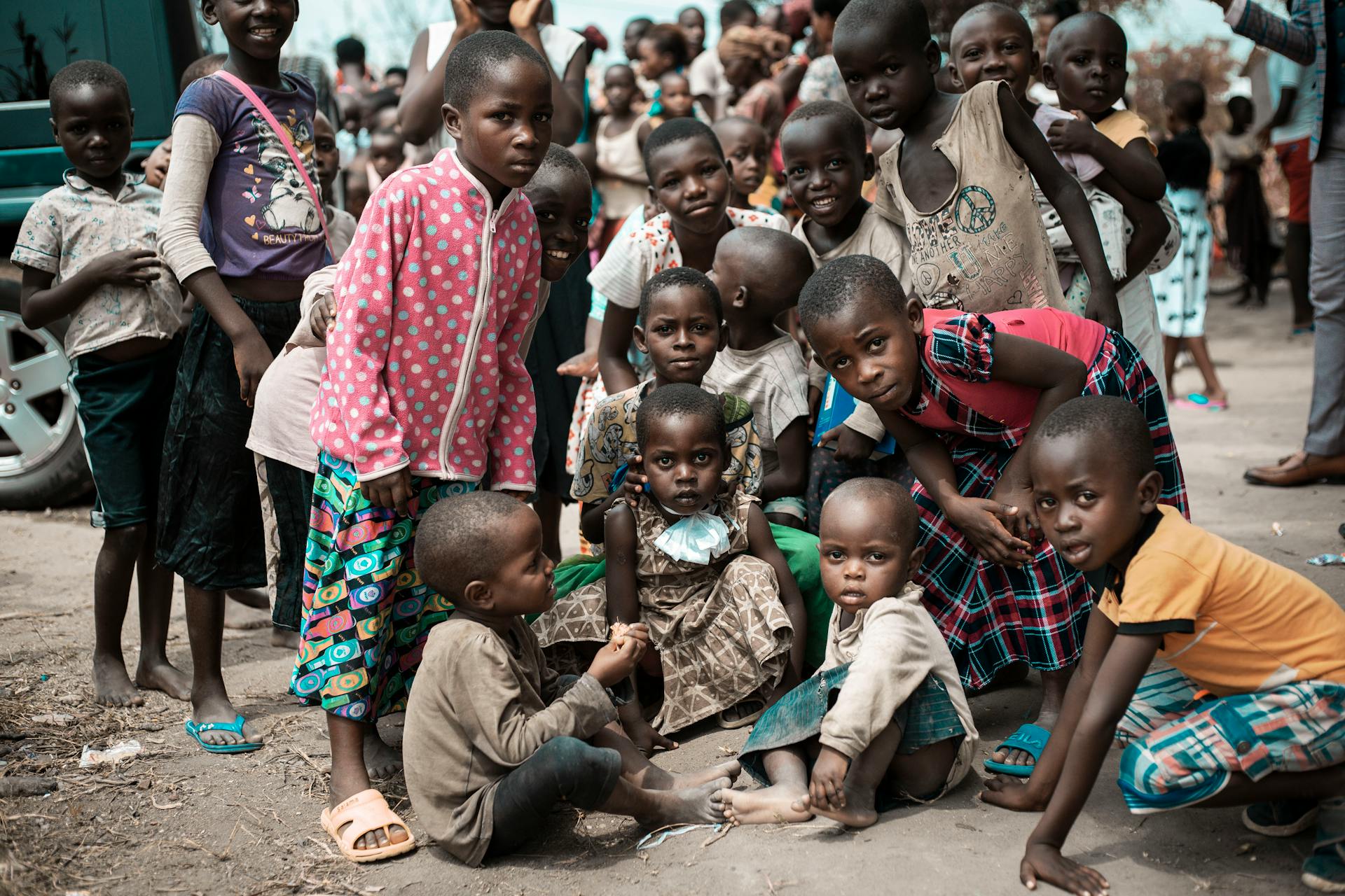 A group of African children gathered outdoors, showcasing community and innocence.