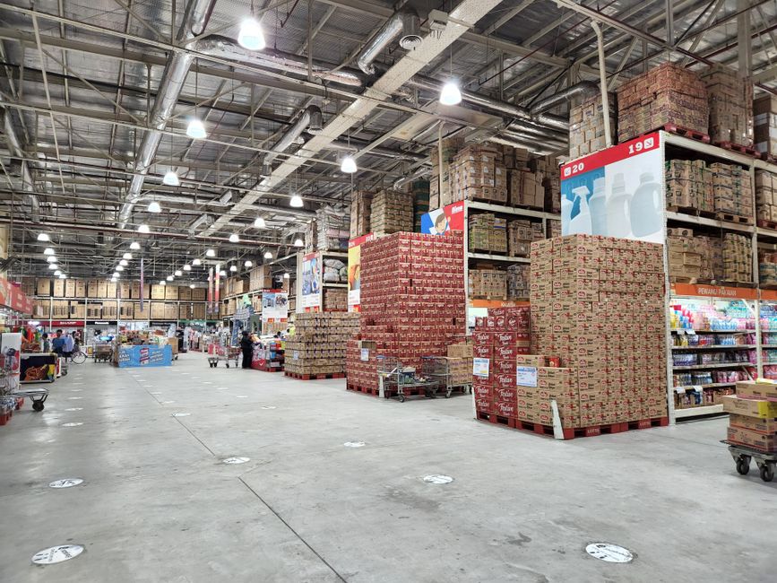 A Yiwu factory worker packing World Cup souvenir flags into boxes