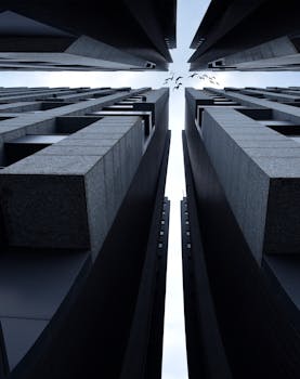 从低角度对比现代摩天大楼与鸟类戏剧性的轮廓