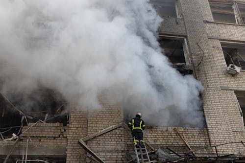 Fireman Standing on Ladder 