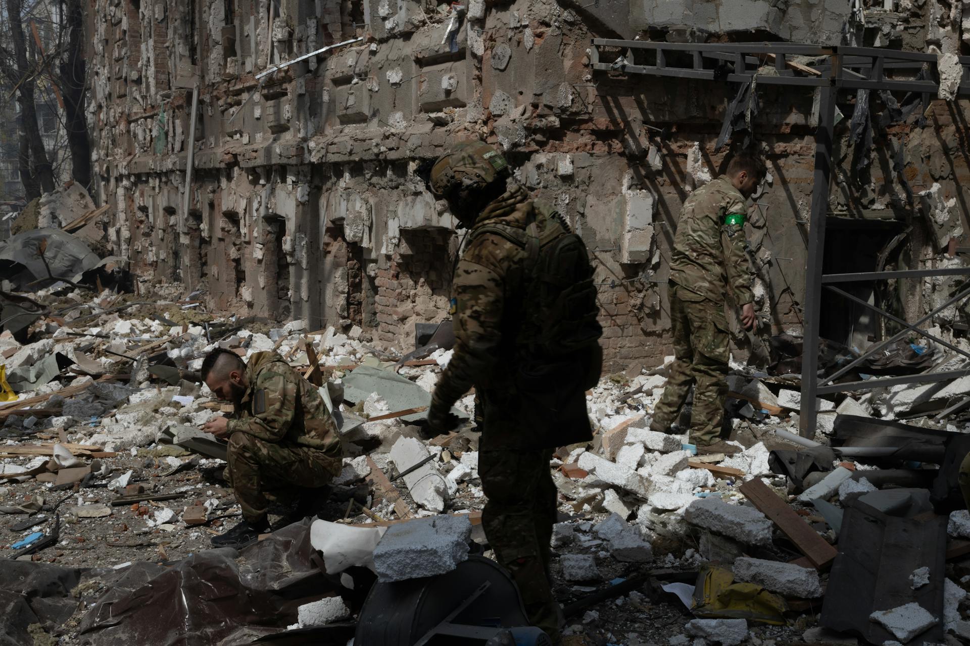 Military Personnel Searching the Wreckage