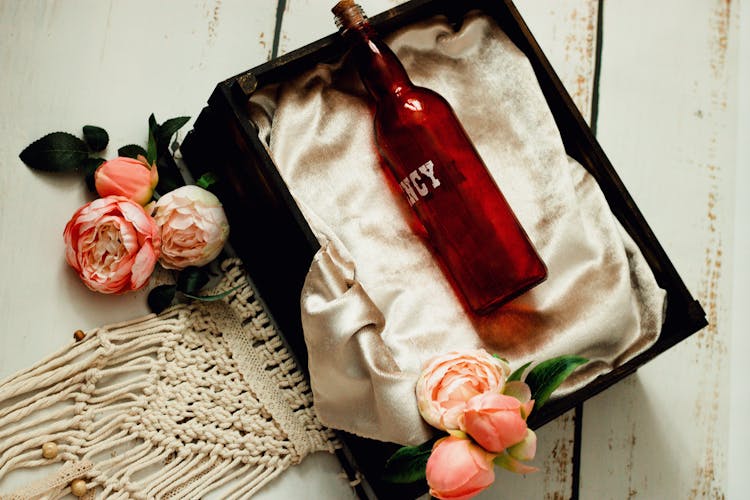 A Bottle In A Black Crate