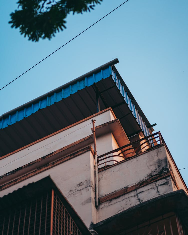 Concrete House With Blue Metal Tile Roof 