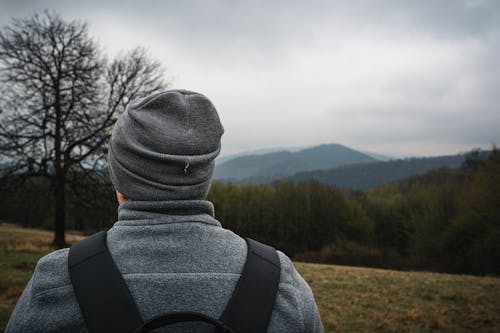 A Person in Gray Knit Cap and Gray Jacket