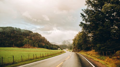 A Road Under the Cloudy Sky