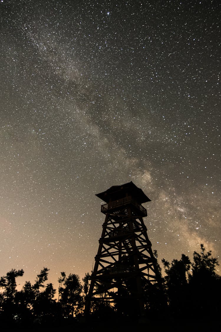 Silhouette Of Observation Tower On Starry Night Sky