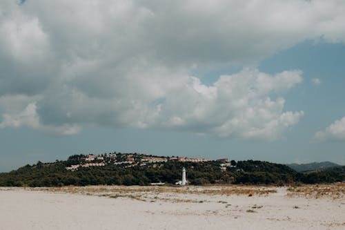 Free Lighthouse on the White Sand  Stock Photo