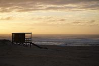 Brown Wooden Lifeguard House on Beach during Sunset