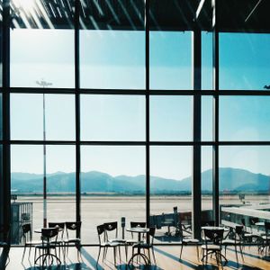 Departure hall windows looking onto the apron — photo by Hardlight on Pexels