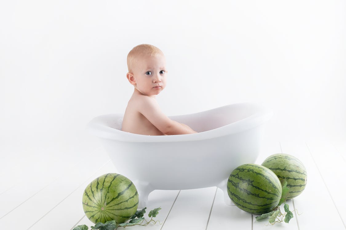 Free Photography of Baby On Bathtub Stock Photo