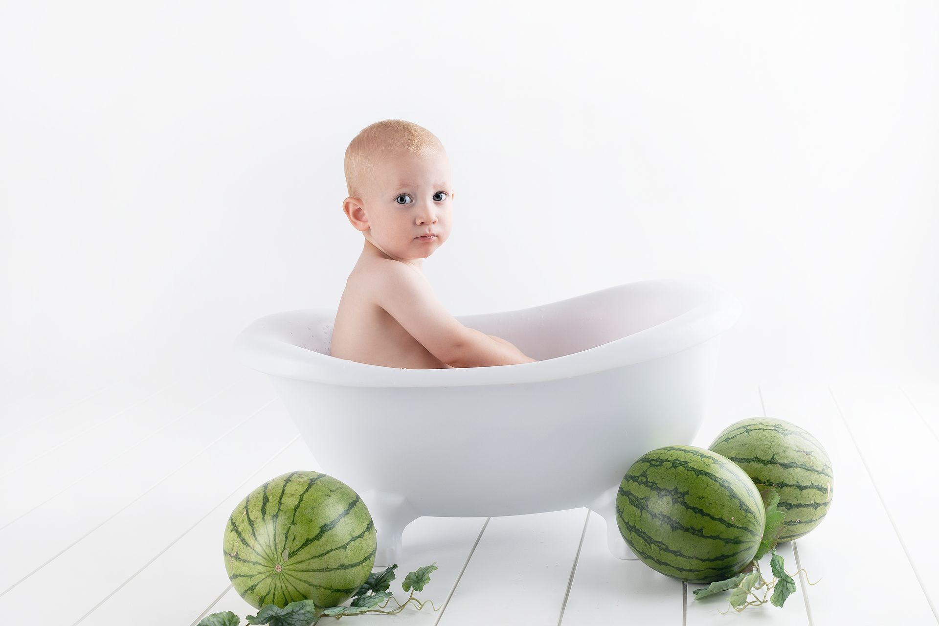 Photography of Baby On Bathtub