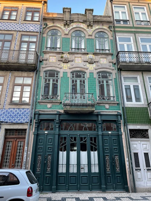 Low angle Shot of Blue and Green Building