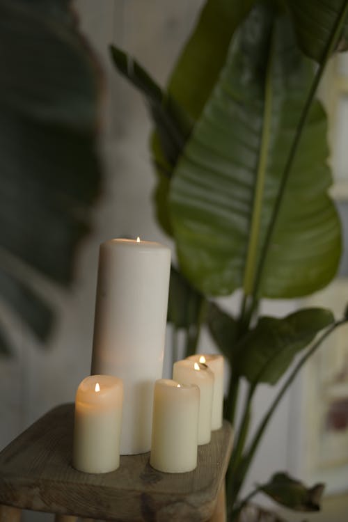 Free Lighted Candles on Wooden Table Stock Photo