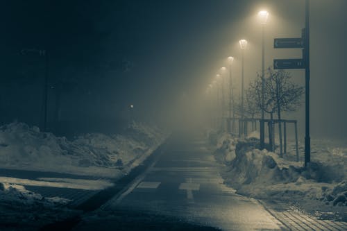 Empty Road Between Thick Snow