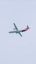 White and Red Airplane in Mid Air