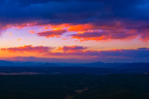 Free Stunning Clouds At Sunset Mountain Landscape Stock Photo