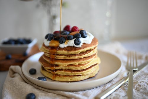 Free Pancakes with Fruits and Whipped Cream  Stock Photo