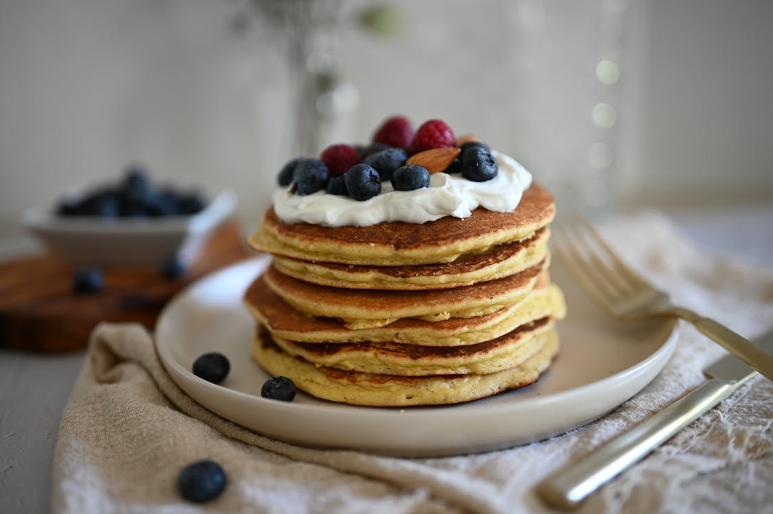 Free Pancakes with Fruits and Whipped Cream  Stock Photo