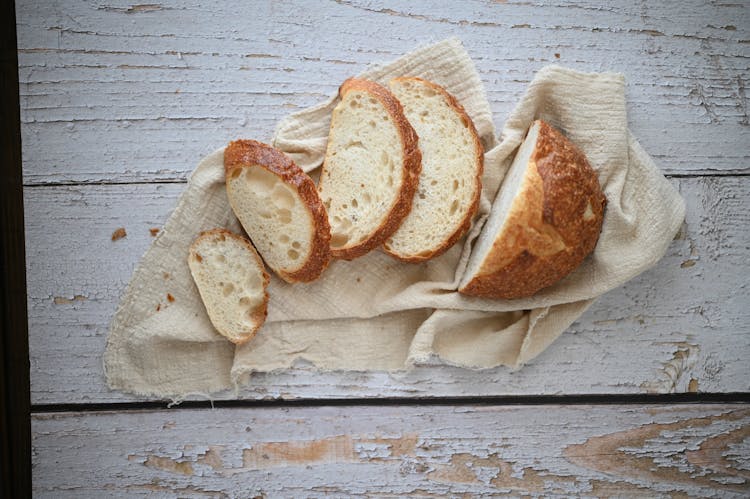 Sourdough Bread Slices On White Fabric 