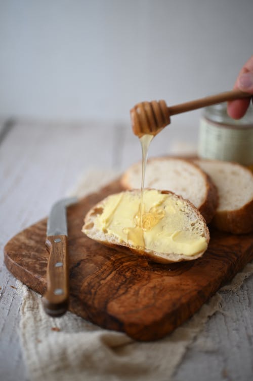 Free Close-up View of Bread with Honey Stock Photo