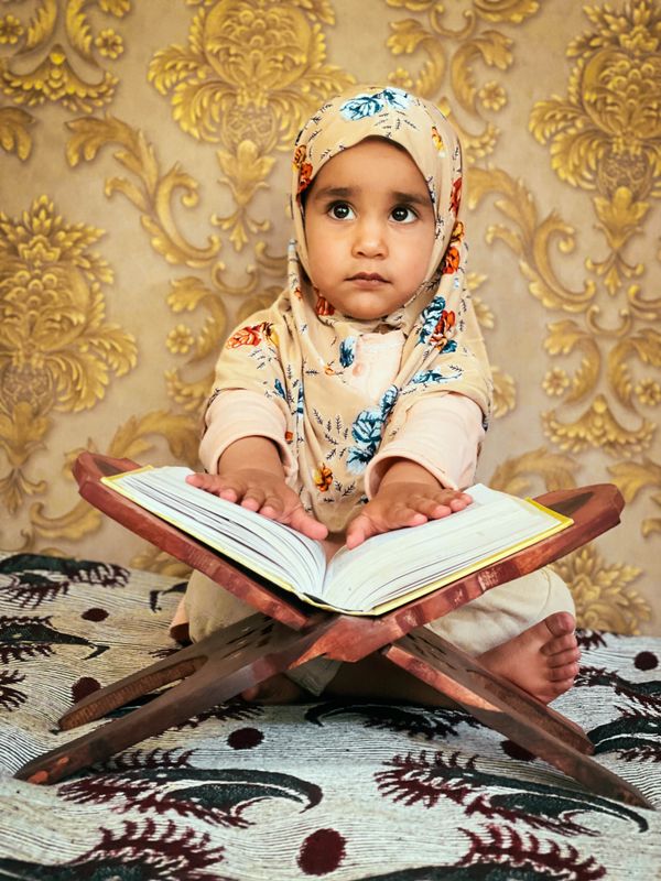 A child reading Quran during Ramadan