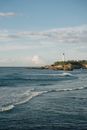 Lone Lighthouse on Shore Overlooking Sea