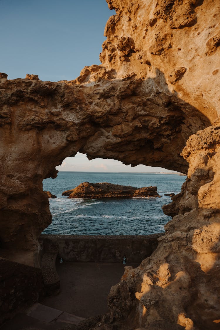 Rocks Forming Arch On Beach