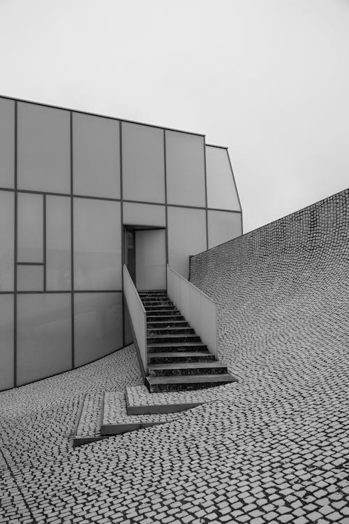 Black and White Photo of Staircase Leading Towards Slope