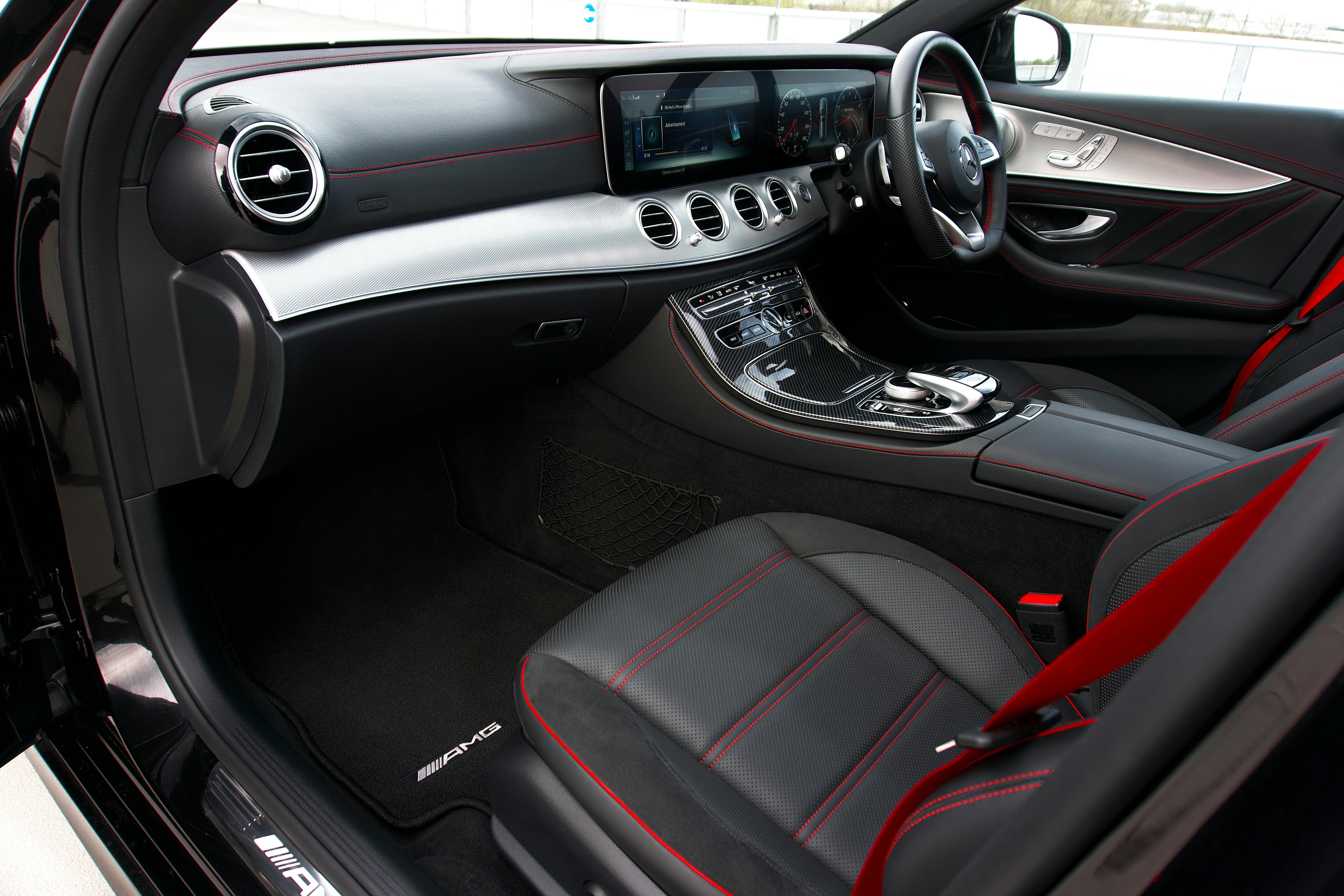 Luxury car interior with personalized monogram stitching and custom ambient lighting - luxury car interior design trends