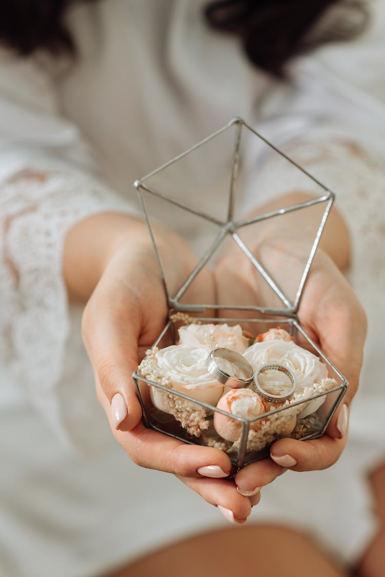 Person Holding A Geometric Ring Bearer Glass Box With Wedding Rings