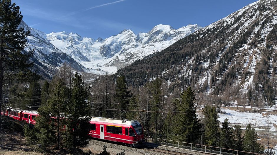 Scenic train winding through mountain landscape
