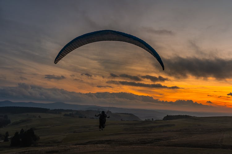 Paragliding At Sunset