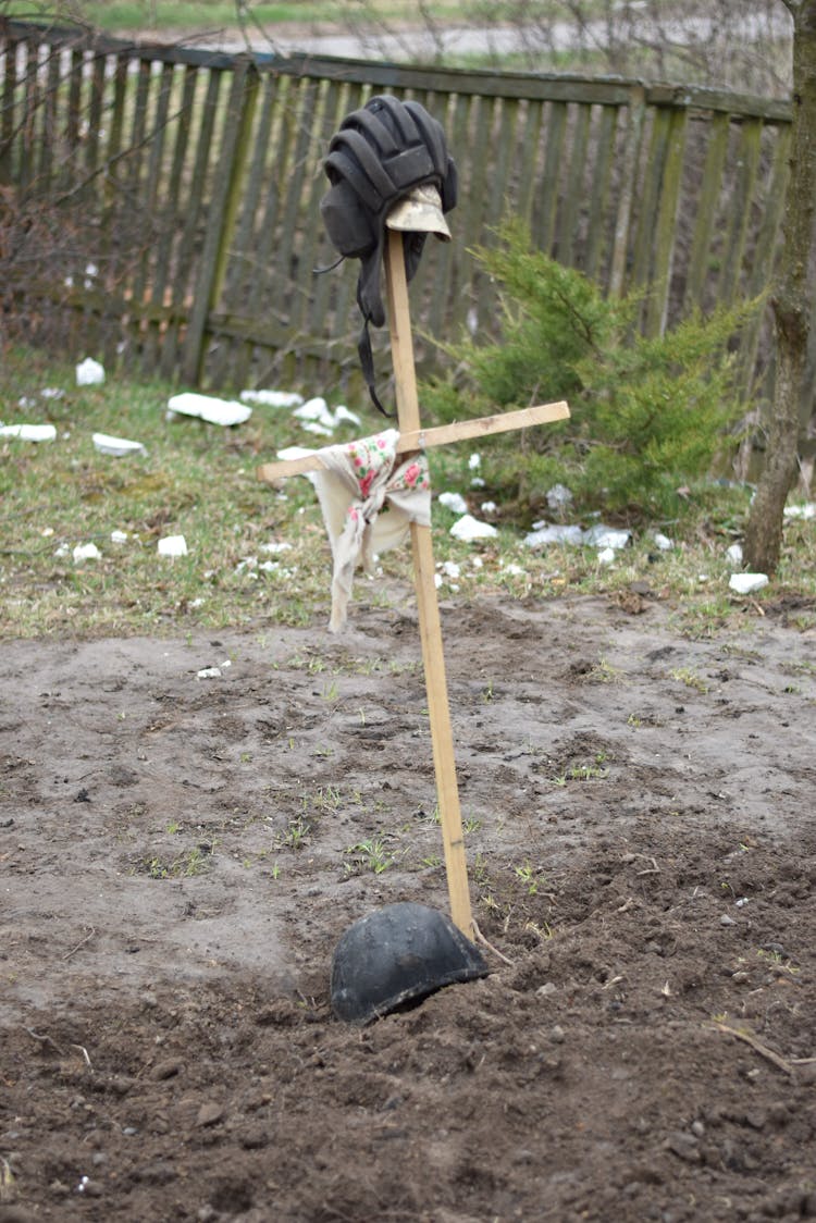 Helmet Left On Top Of Makeshift Wooden Cross