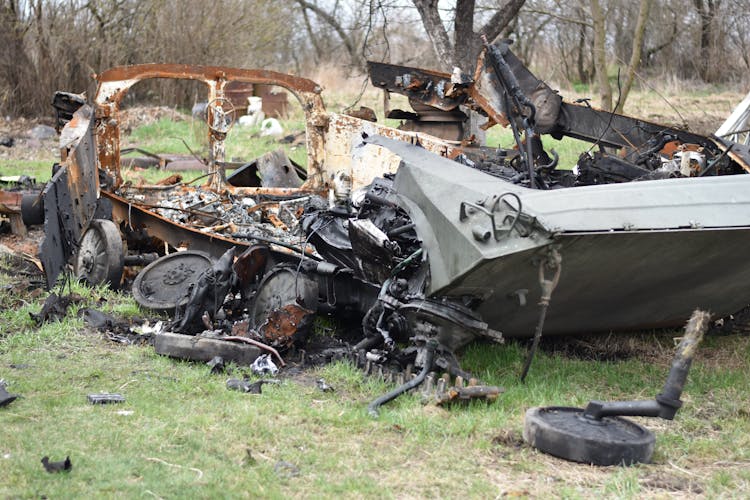 Wrecked Car On Green Grass Field