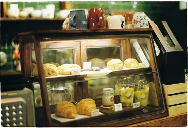 Morning pastry case filled with golden baked goods in Sydney