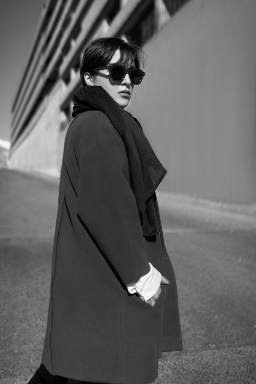 Grayscale Photo of Woman Wearing Coat