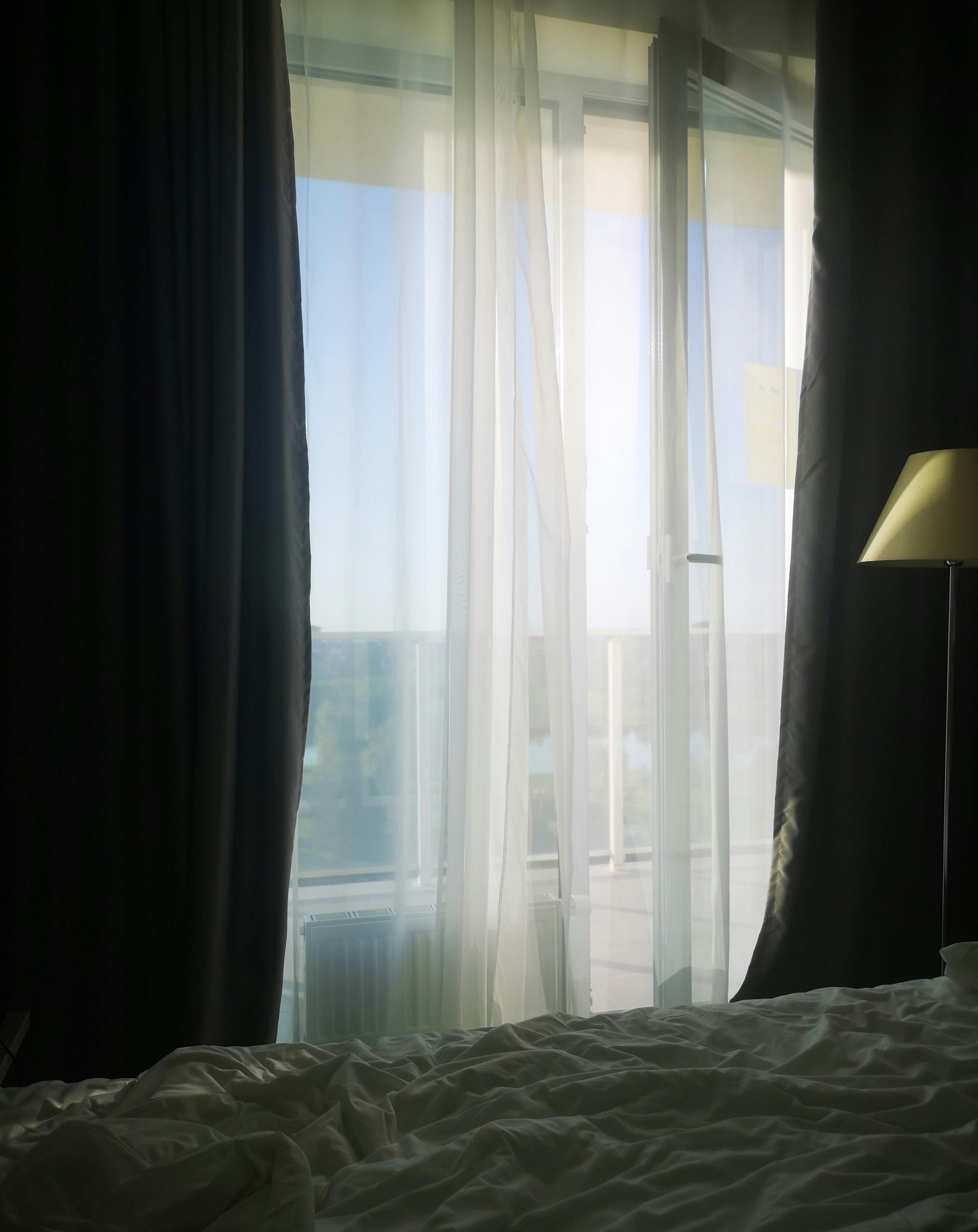 Dark Hotel Room with Curtains Drawn · Free Stock Photo