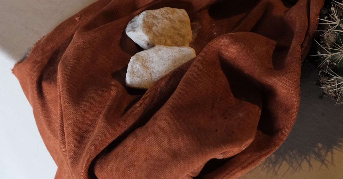 Wadding Textile Sample Rocks Rocks on Top of a Textile · Free Stock Photo