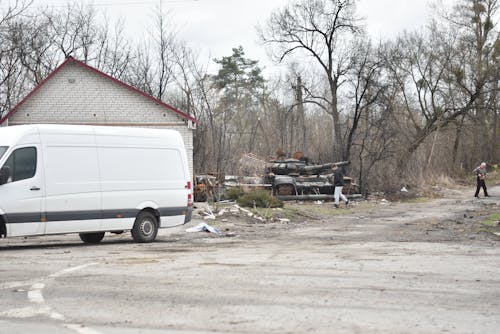 Destroyed Military Vehicle Near Bare Trees